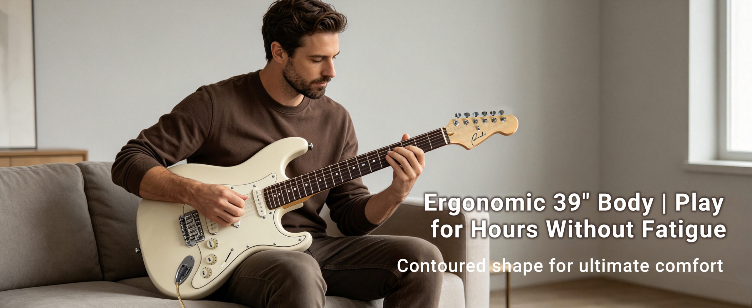 Player holding Ranch 39 inch electric guitar demonstrating comfortable ergonomic body design