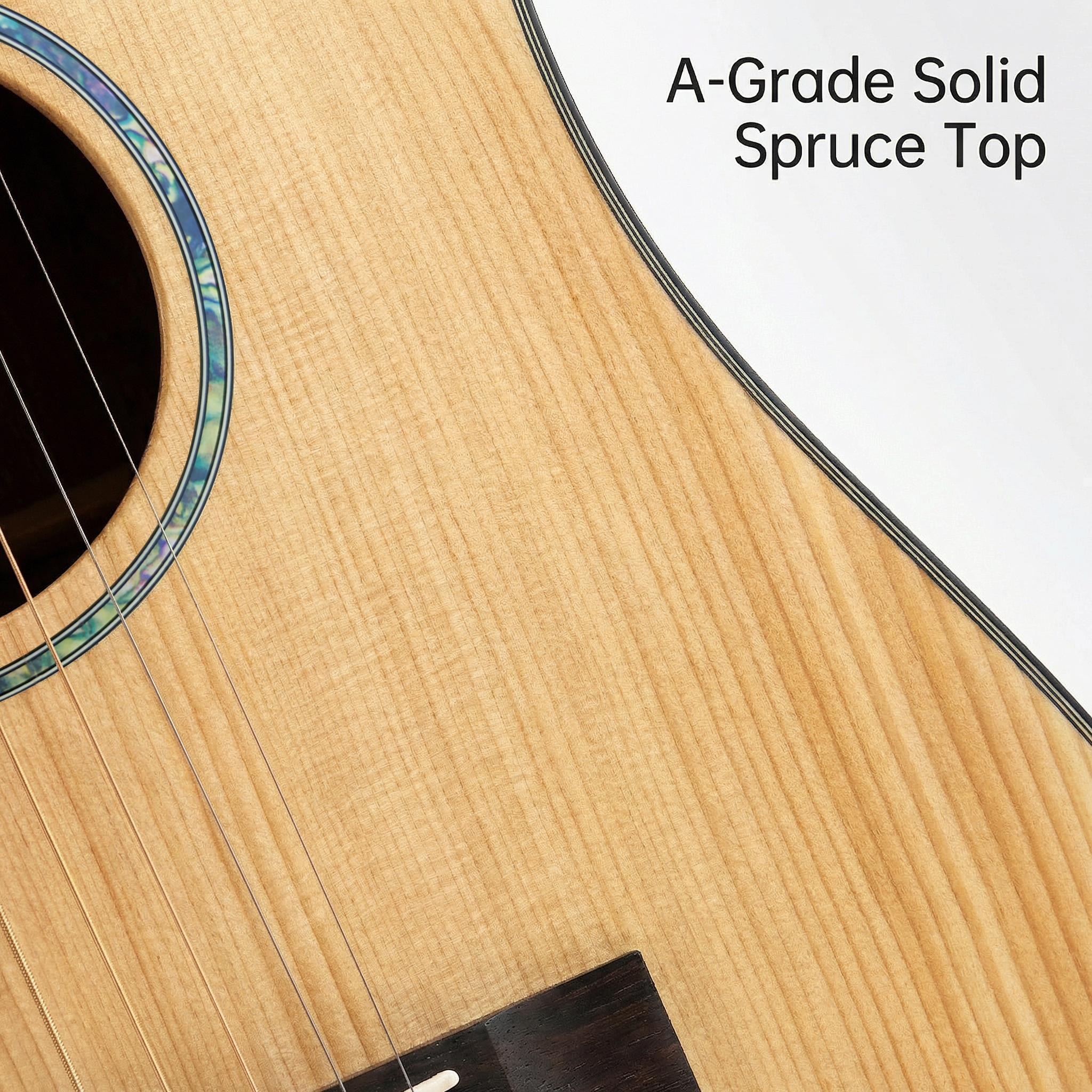 grade-a-solid-spruce-top-guitar-close-up.jpg Close-up detail of A-grade solid spruce top on a natural matte acoustic guitar