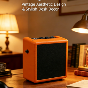 Vintage orange mini guitar amp acting as a stylish desk decor on a wooden table