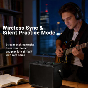 Guitarist playing electric guitar with headphones muted practice at home on desktop amp